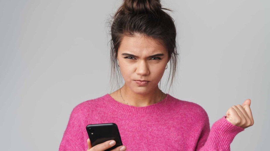 Angry Woman looking at cellphone
