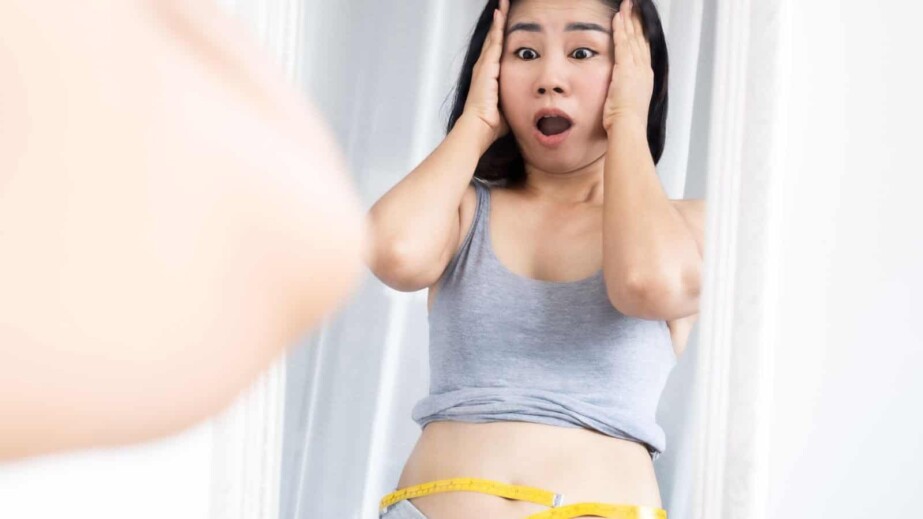 Asian woman shocked with weight gain