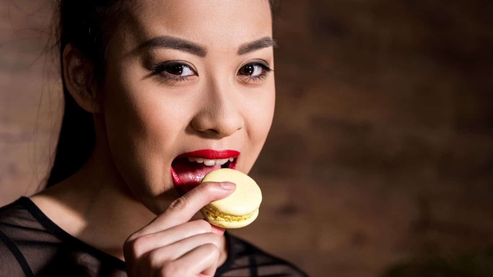 Asian woman with macaron