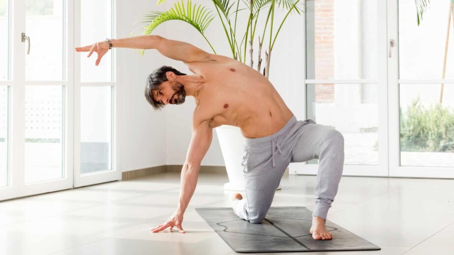 Athletic Man Practicing Yoga Indoors