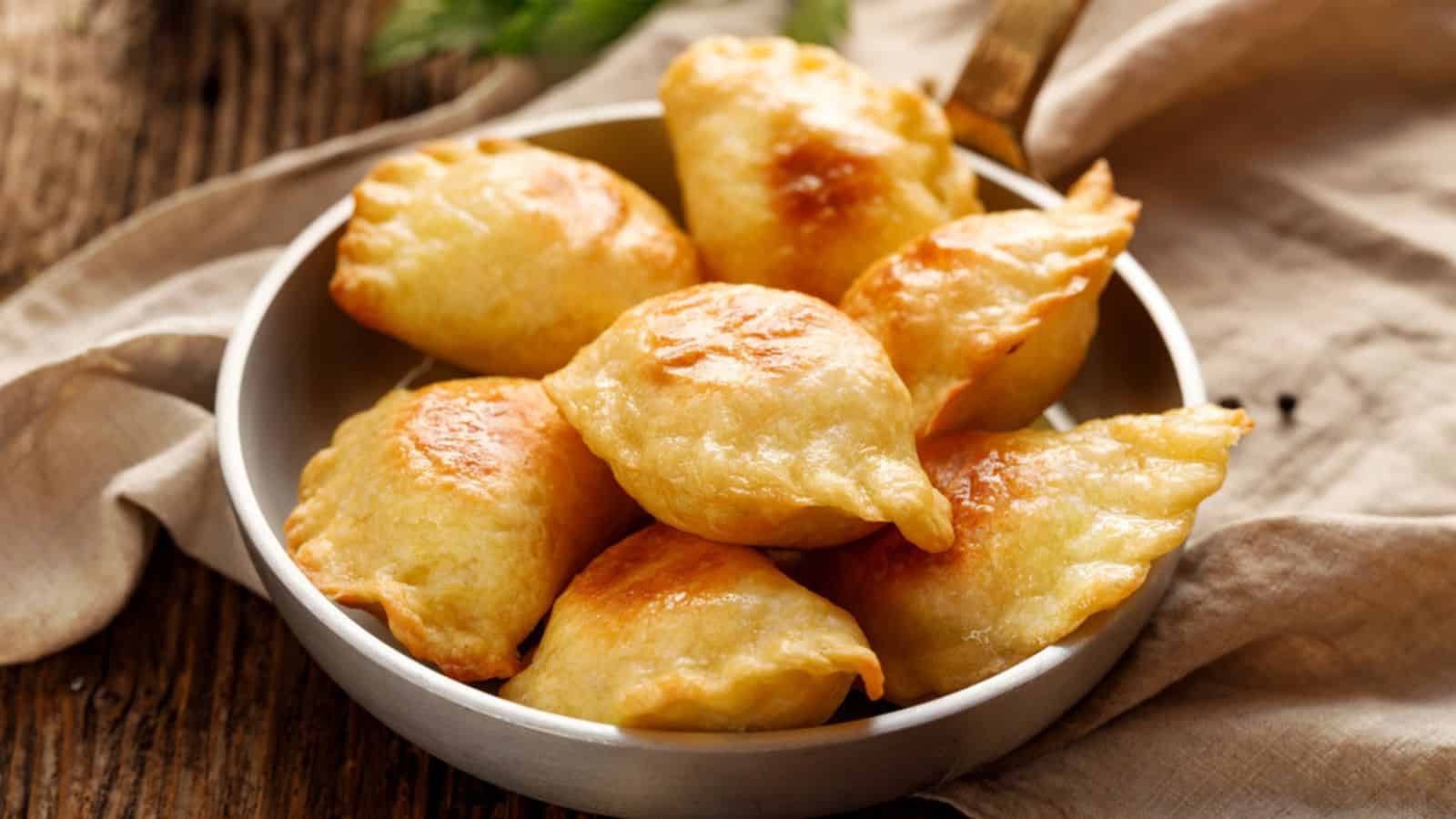 Baked dumplings stuffed with curd cheese and potatoes