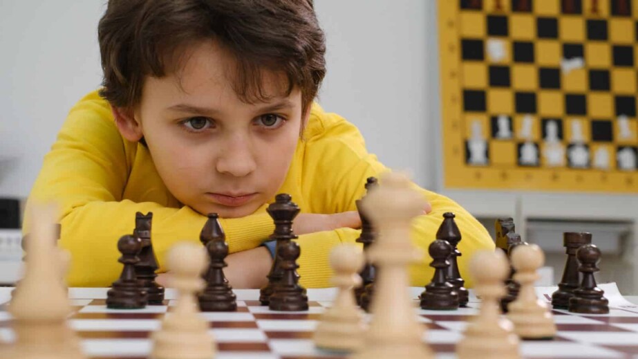 Caucasian Boy playing chess
