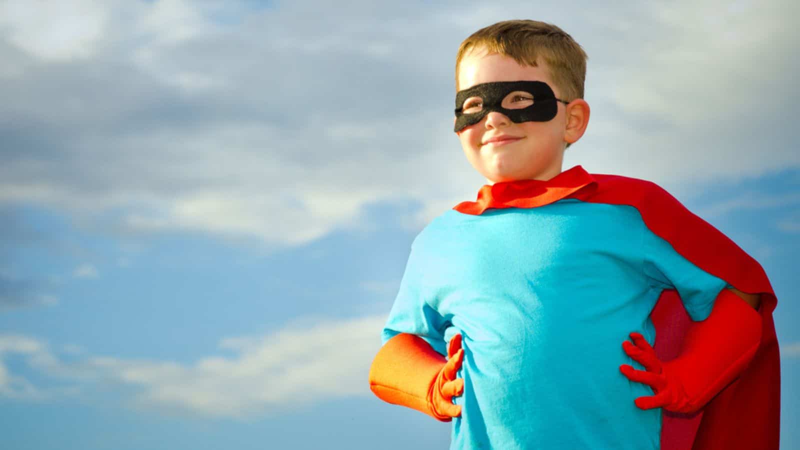 Child pretending to be a superhero