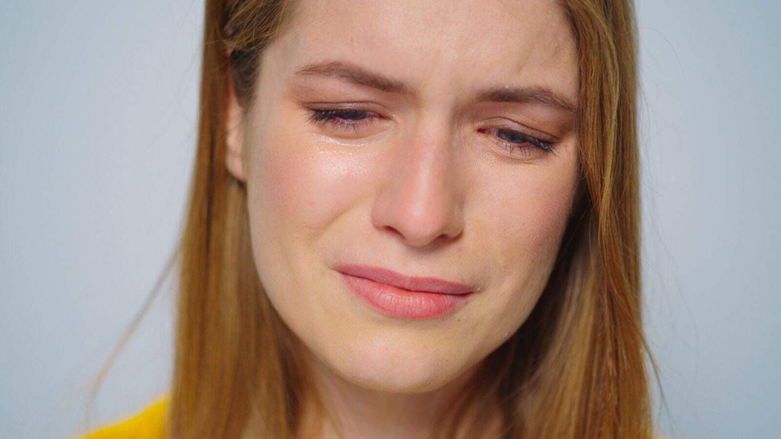 Closeup crying woman posing with sad mood