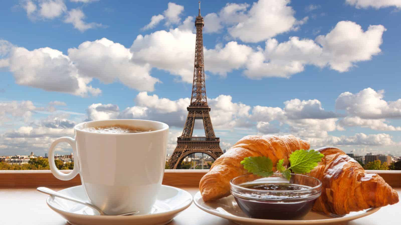 Coffee with croissants against Eiffel Tower in Paris
