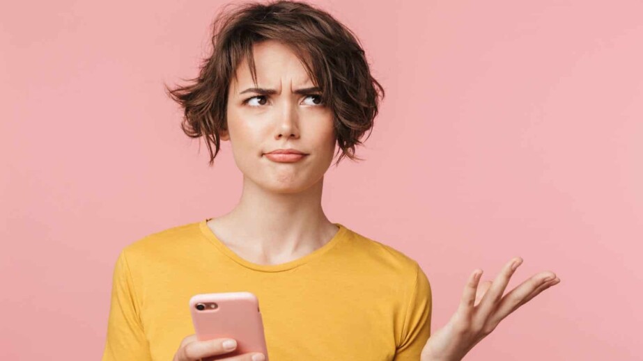 Confused Woman Using Smartphone