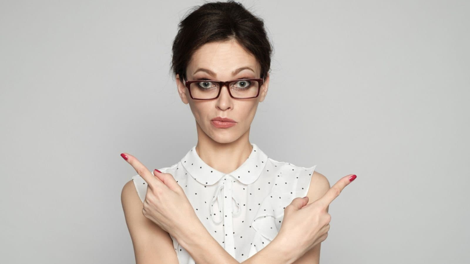 Confused female teacher in glasses