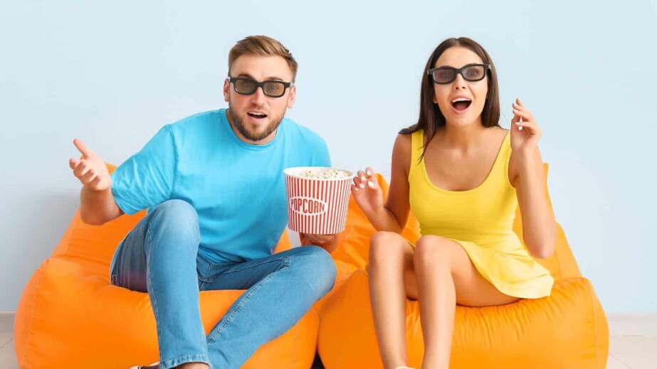 Couple watching movie indoors