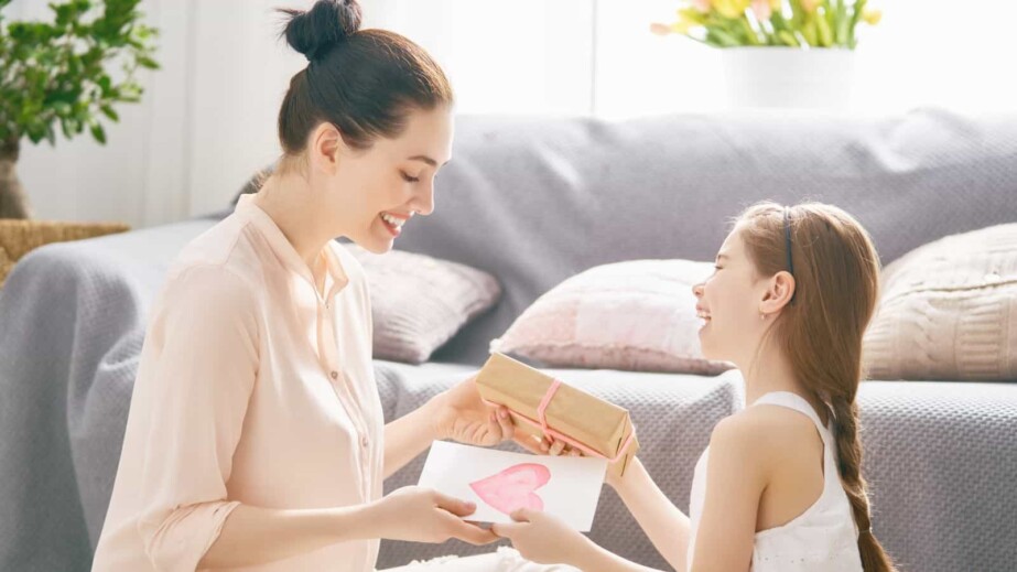 Daughter Giving Gift to Mom