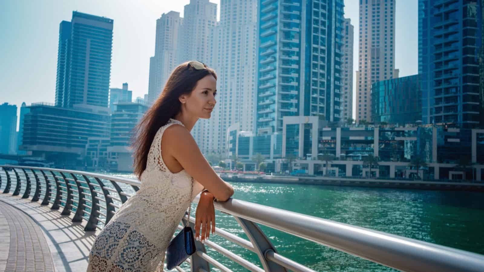 Dubai travel tourist woman on vacation walking