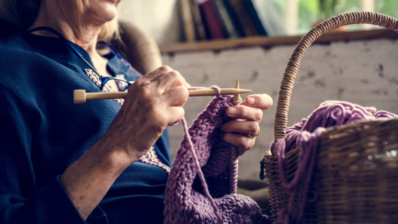 Elderly woman knitting handicraft hobby