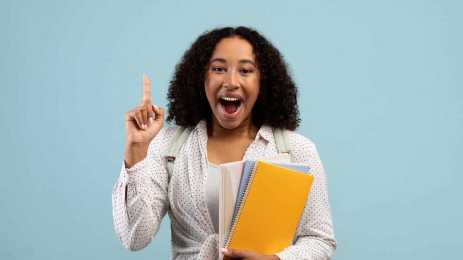 Excited young black woman having great idea