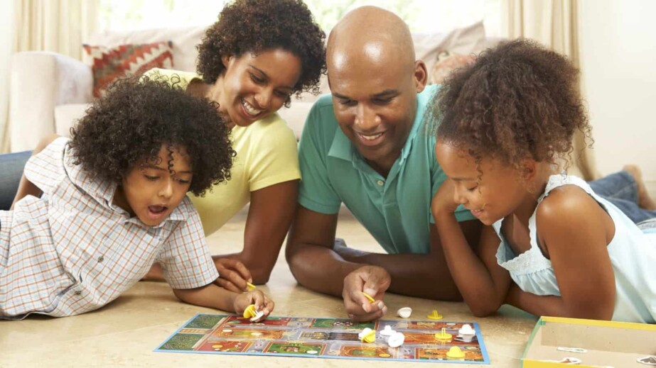 Family Playing Board Game at Home