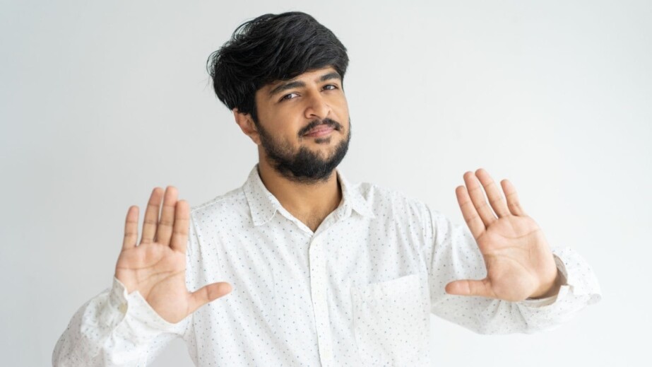 Friendly Indian Guy Gesturing Stop, Enough