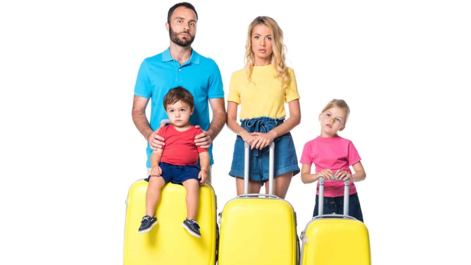 Front view of family with yellow suitcases