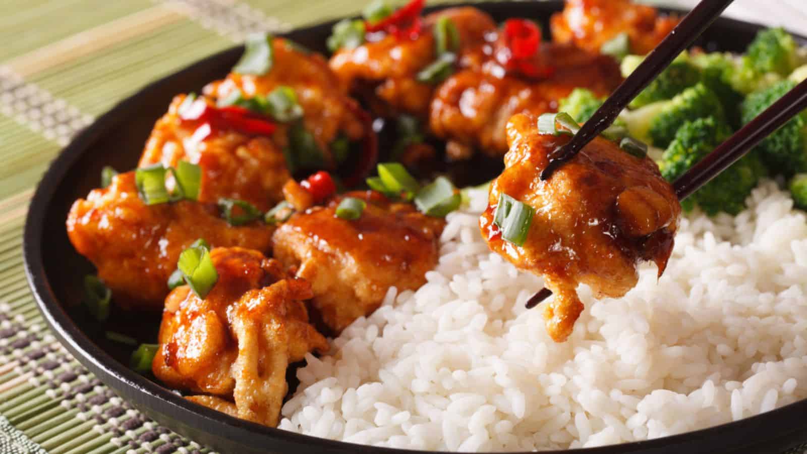 General Tso's chicken with rice for dinner. Horizontal close-up
