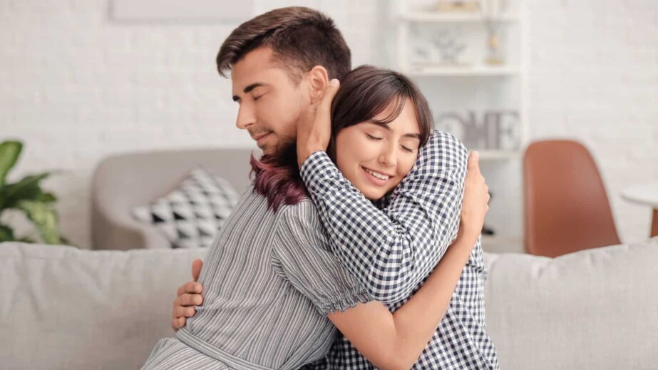 Happy Couple Hugging after Quarrel at Home