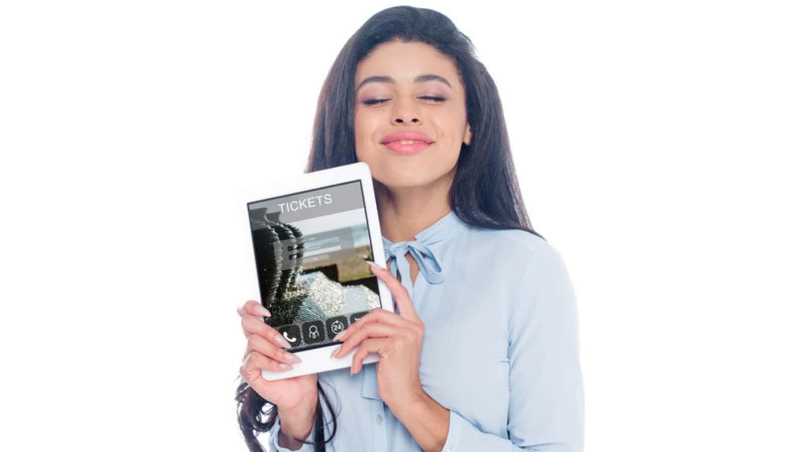 Happy young african american woman holding digital tablet