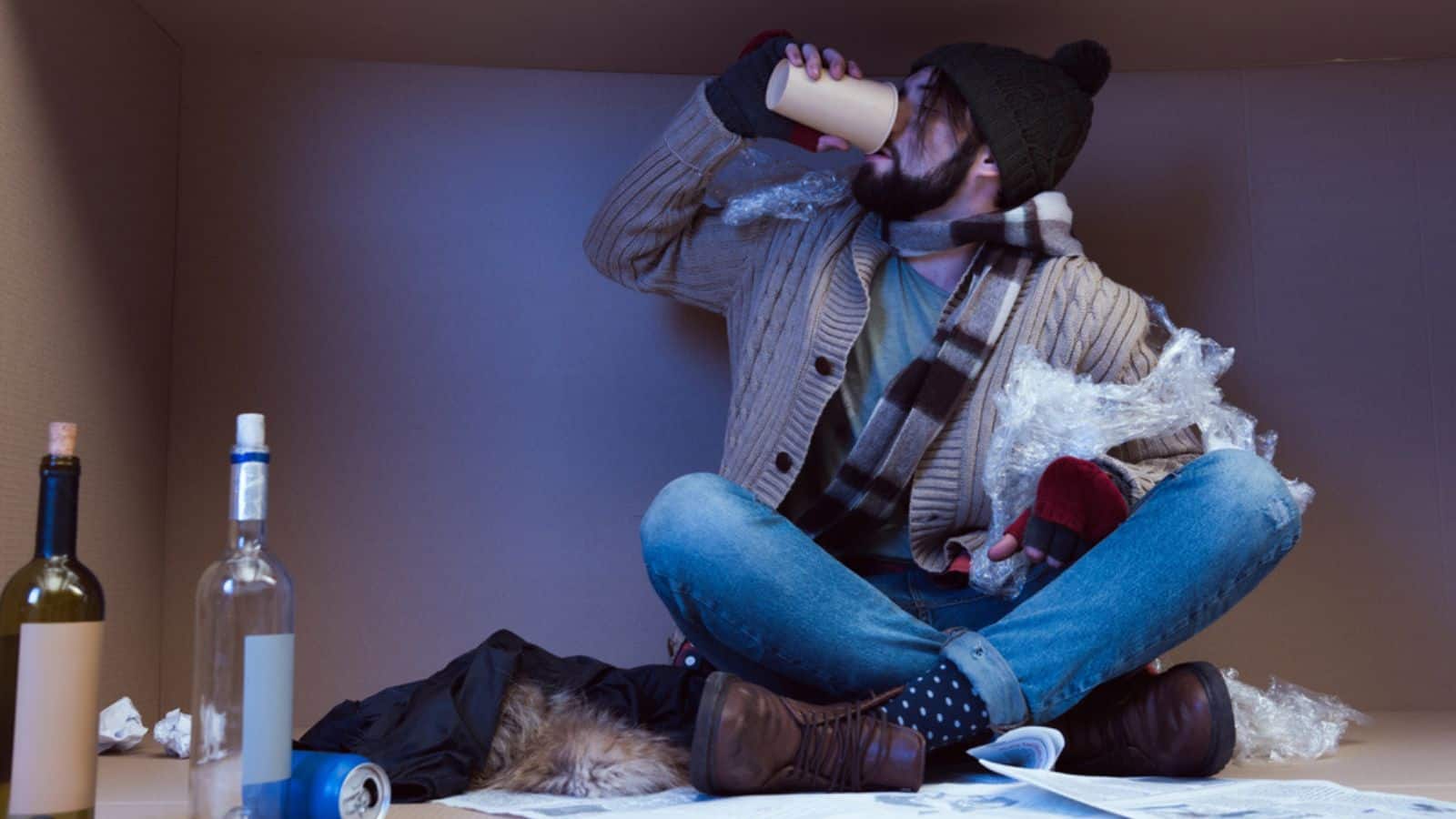 Homeless man drunking alcohol