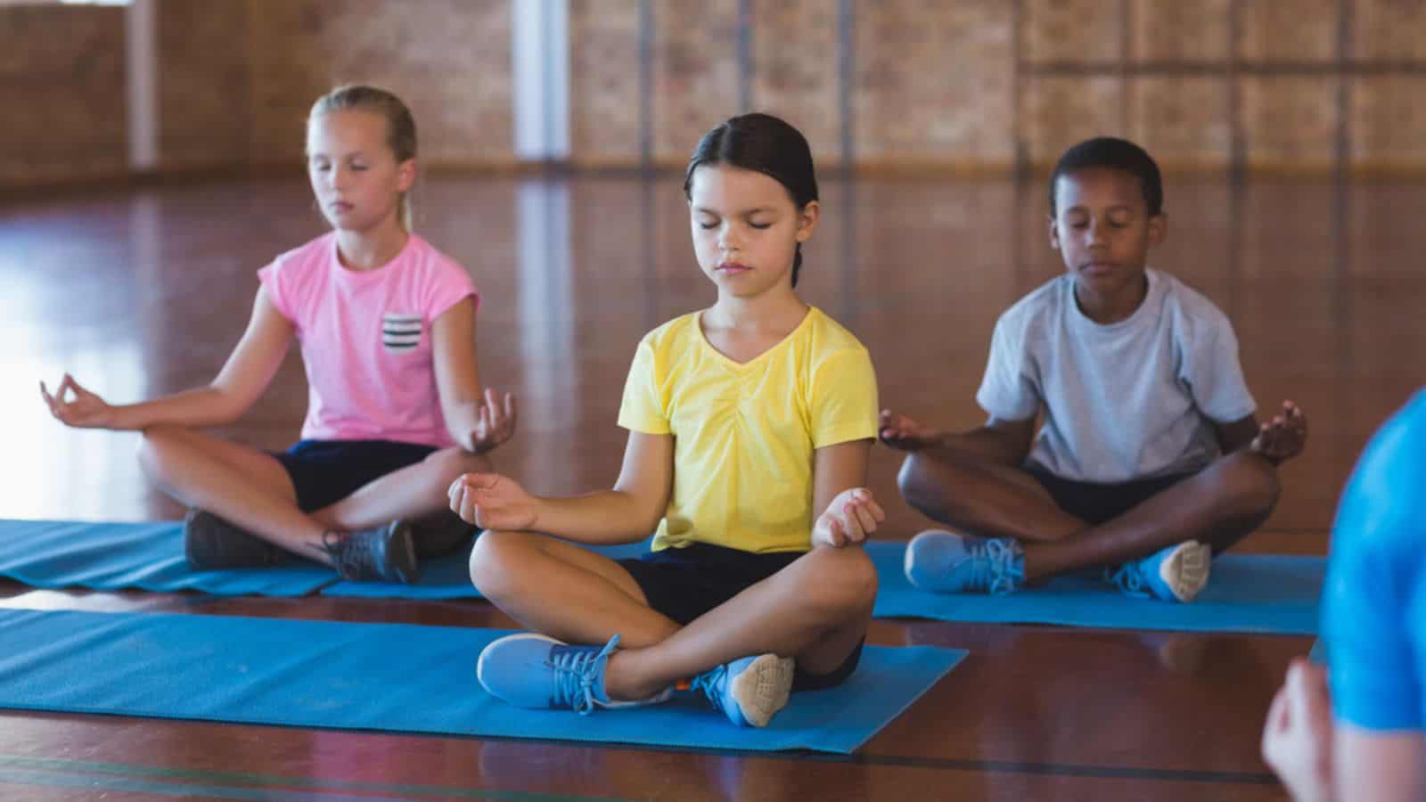 Kids meditating during yoga