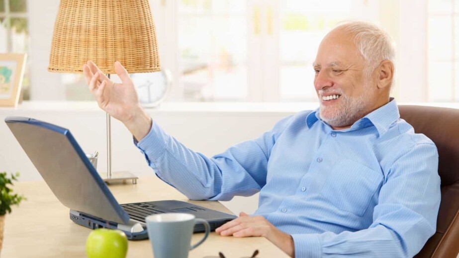 Laughing Old Man Using Laptop