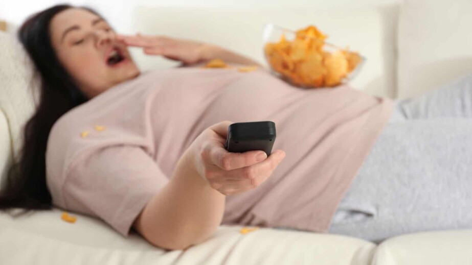 Lazy Woman with Chips Watching TV at Home