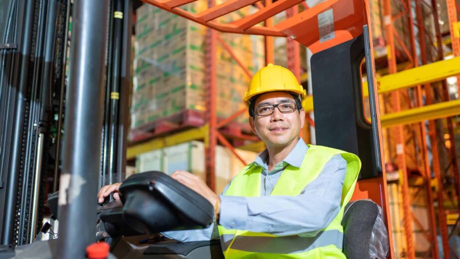 Male Forklift Driver in Warehouse