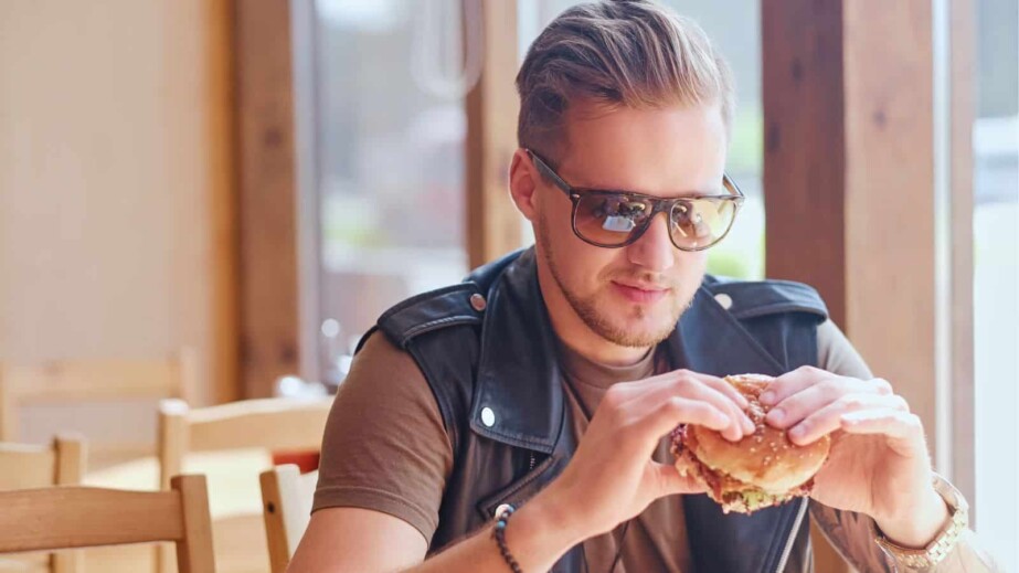 Man eating a vegan burger