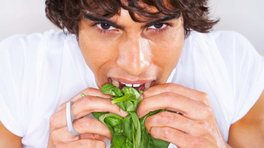 Man eating spinach