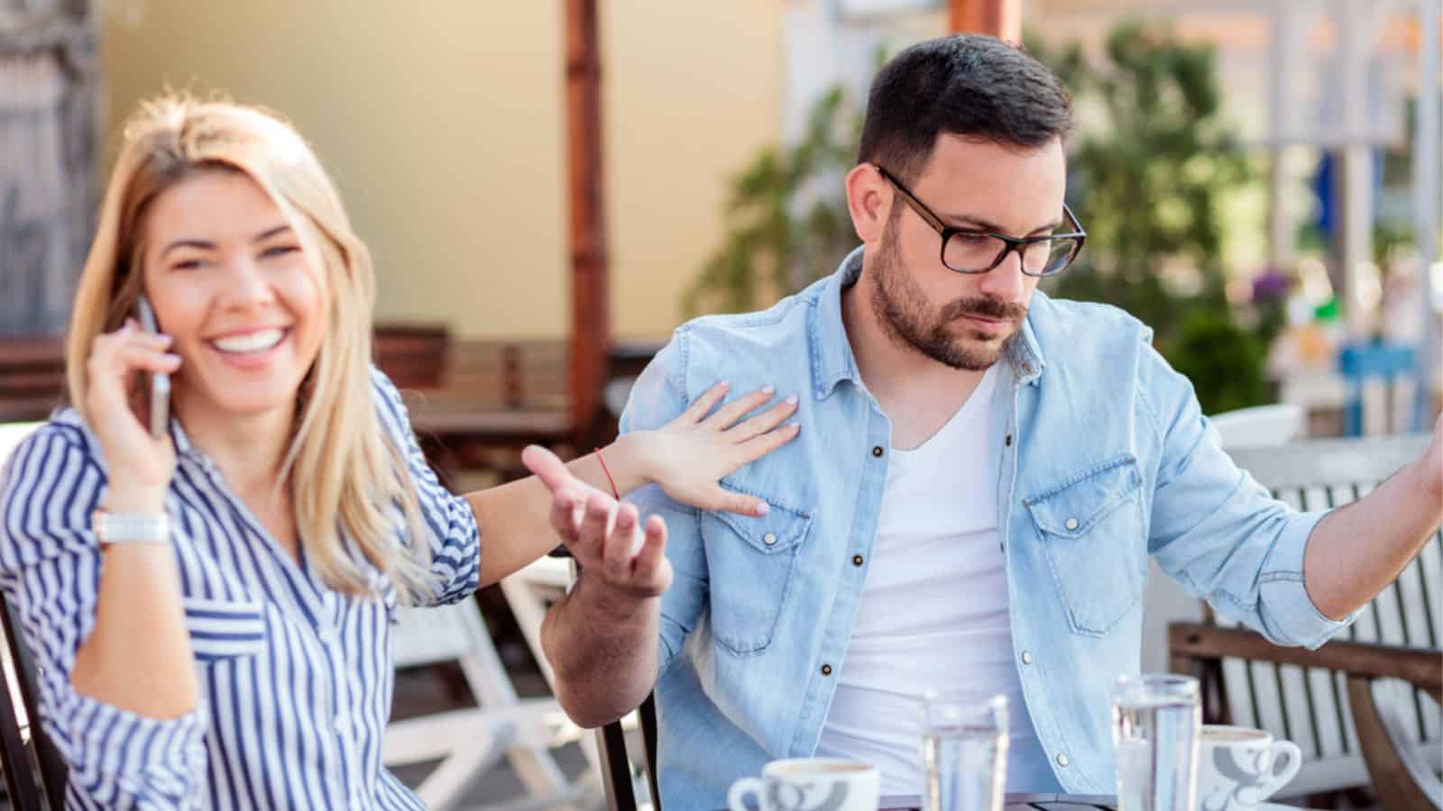 Man is annoyed as his girlfriend spends too much time talking on the phone