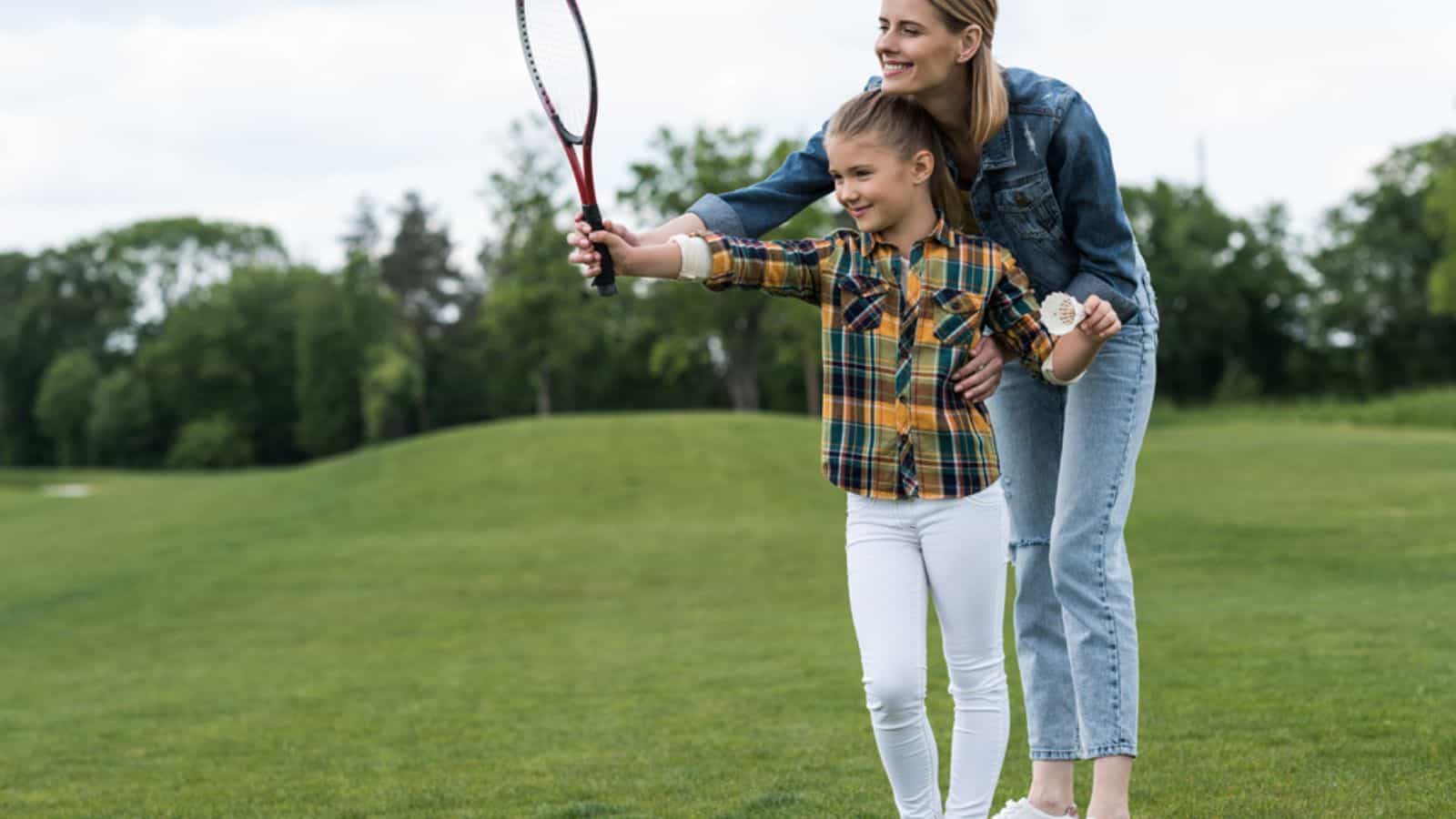 Mother and daughter with badminton racquet
