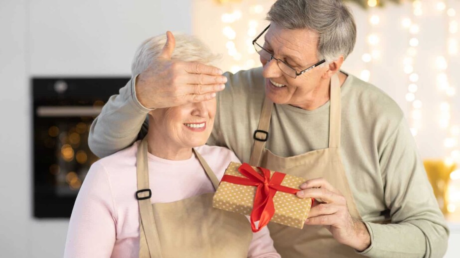 Old man surprising wife with gift