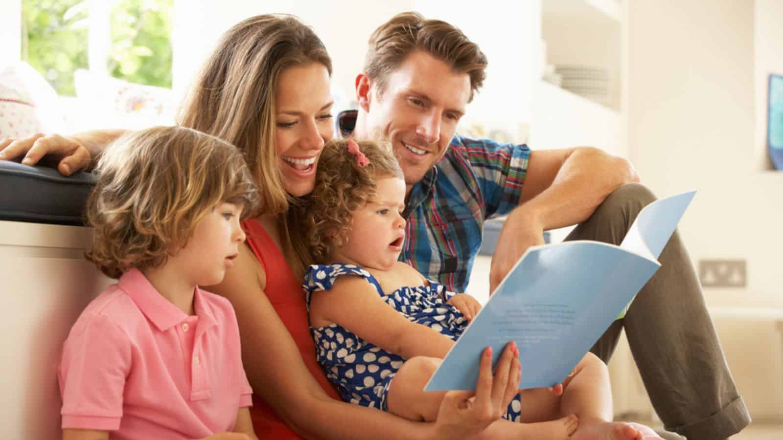 Parents Sitting With Children Reading Story