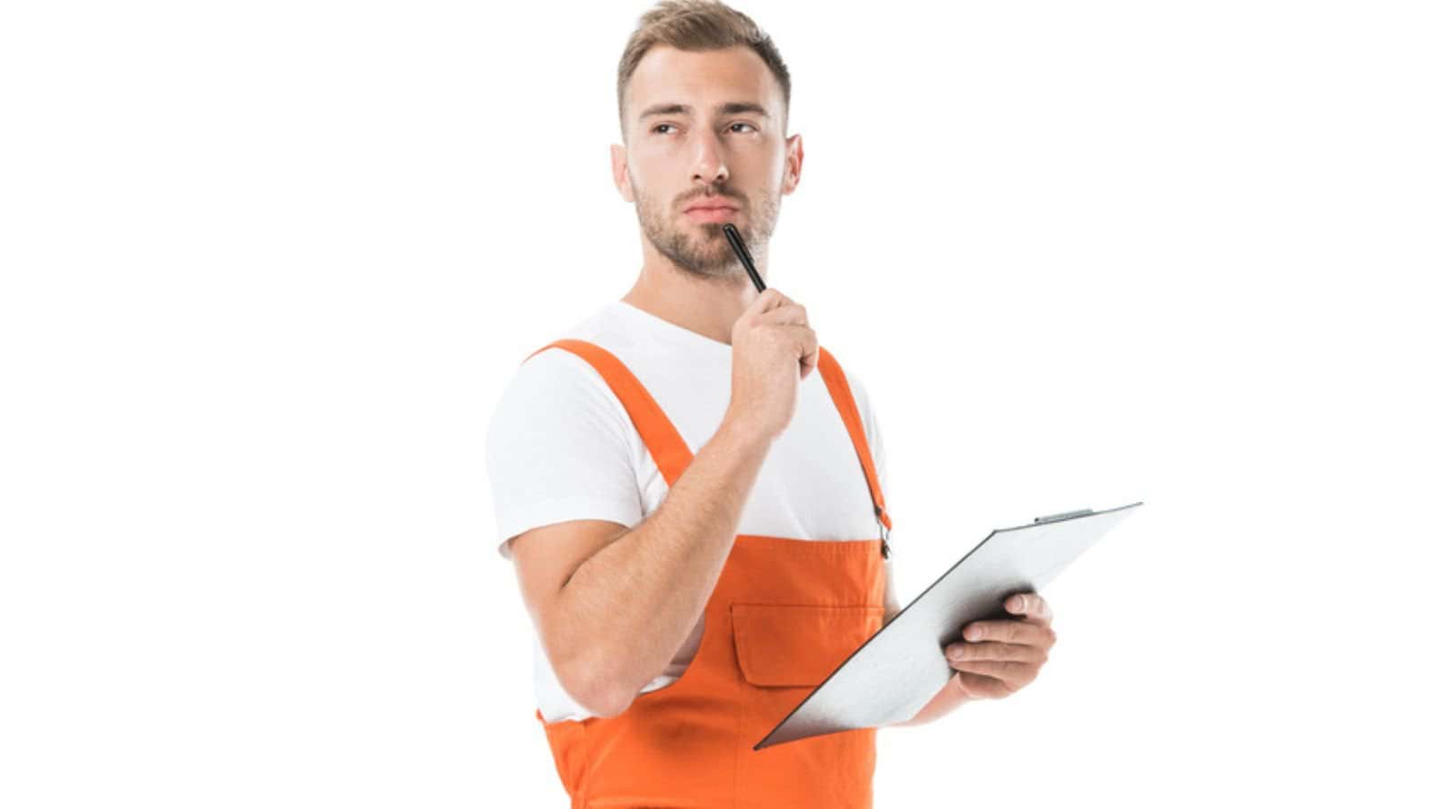 Pensive handsome auto mechanic in orange uniform