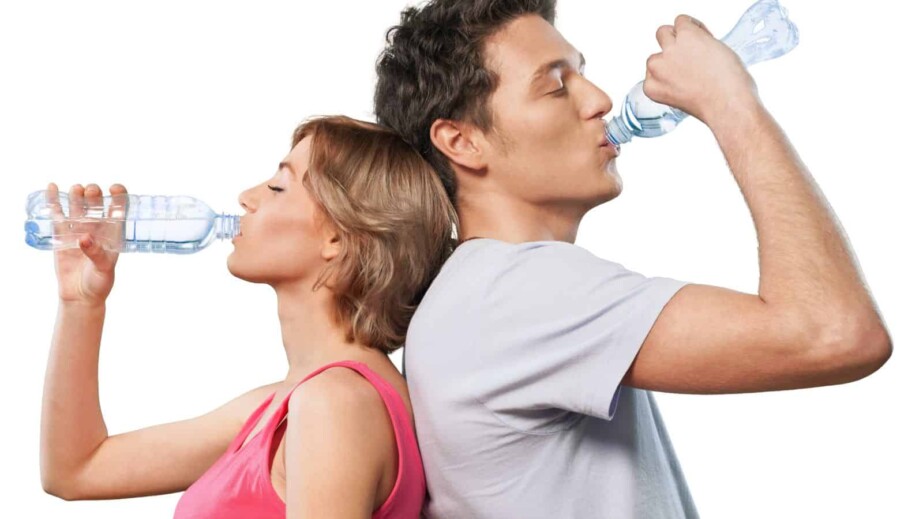 Portrait of Young Couple Drinking Water