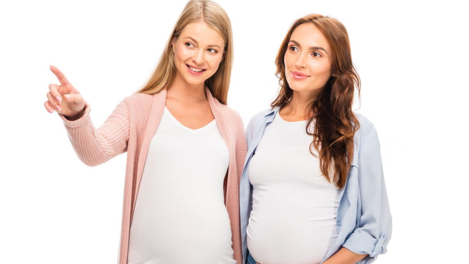 Pregnant women pointing at something with finger and looking