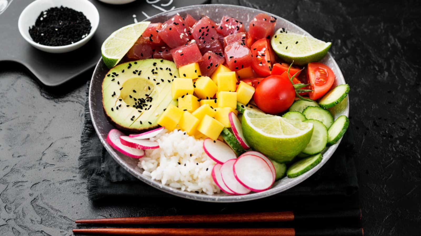 Raw organic ahi tuna poke bowl with rice and veggies