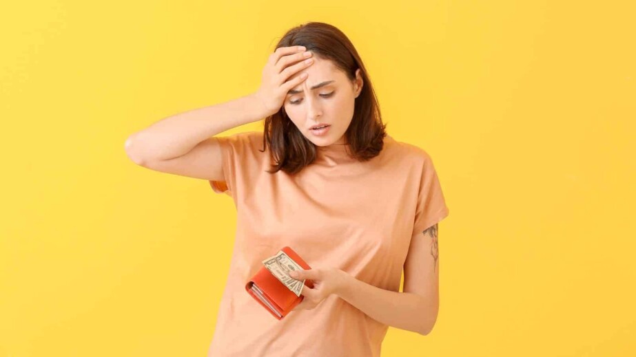 Sad Young Woman with Wallet