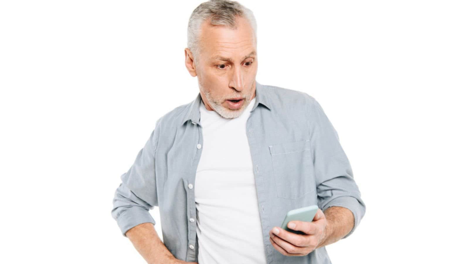 Shocked man with smartphone