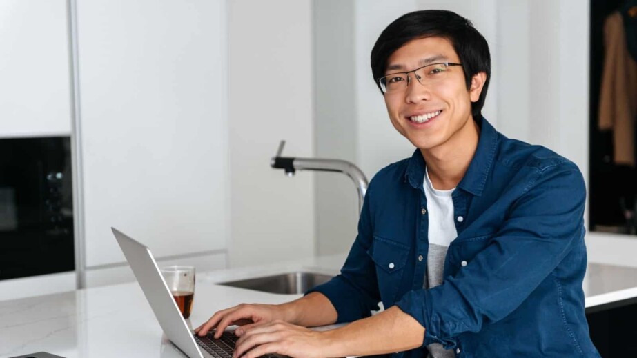 Smiling Asian Man Working