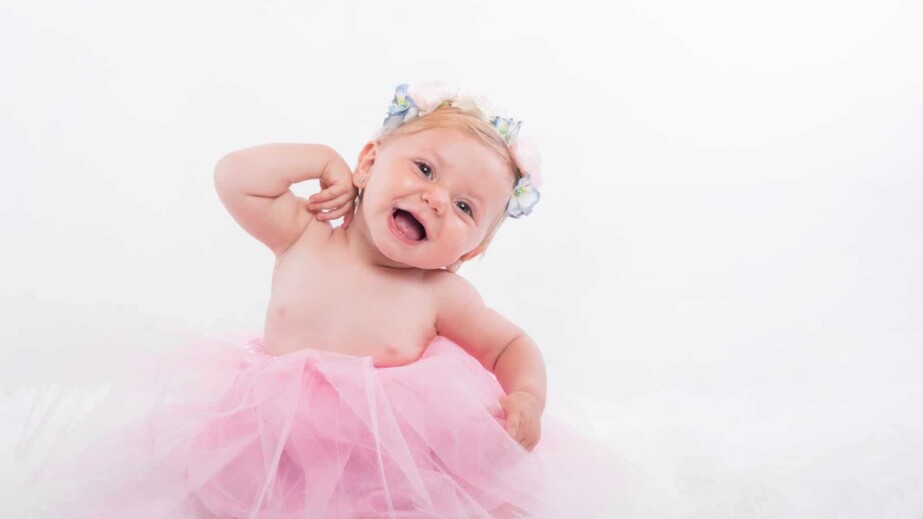 Smiling baby girl dressed as a Ballerina
