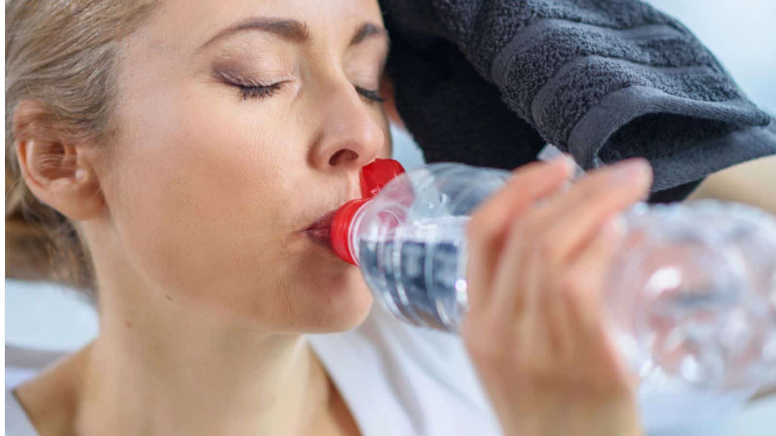 Sportswoman drinking water
