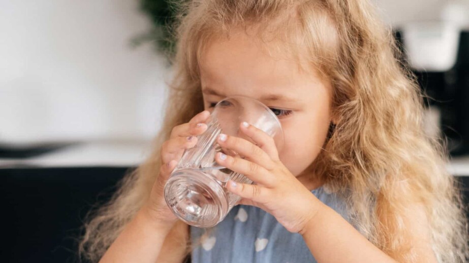 Toddler girl drinking water