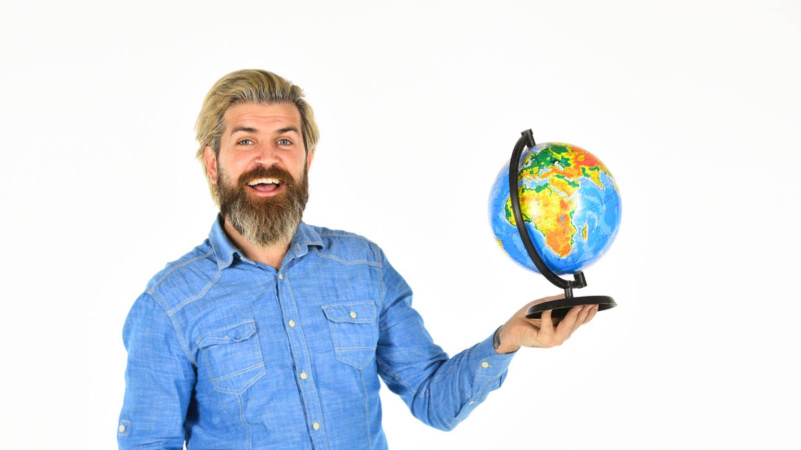 Travel and wanderlust. Bearded man with globe