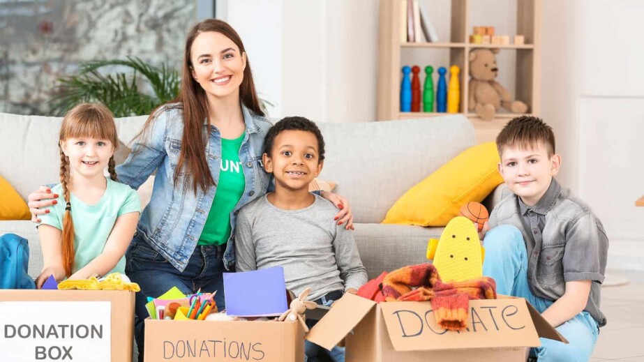 Volunteer with donations and children
