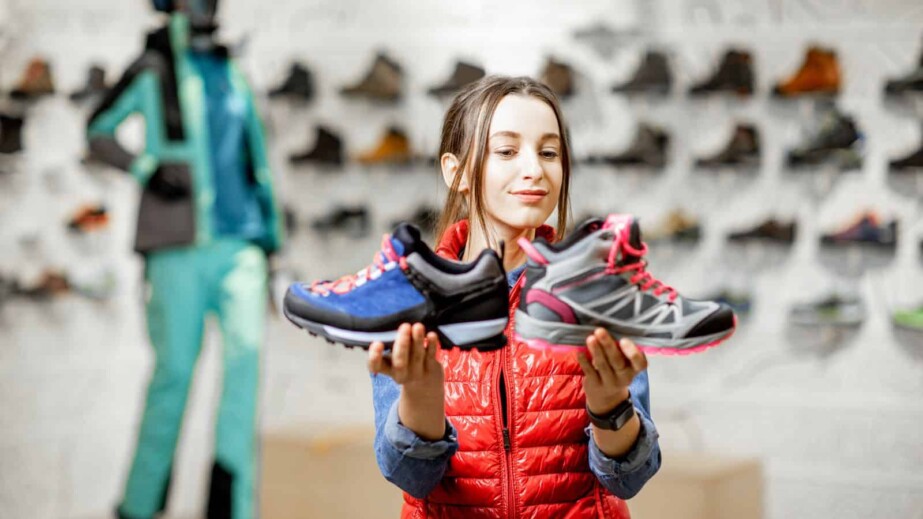 Woman Choosing Between Two Sport Shoes