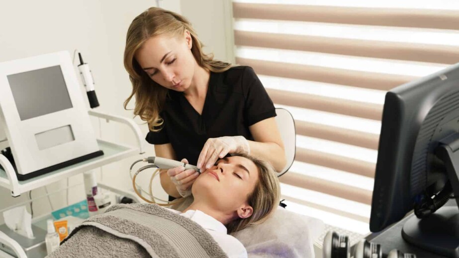 Woman during Deep Facial Cleansing in a Cosmetology Clinic - A's Images