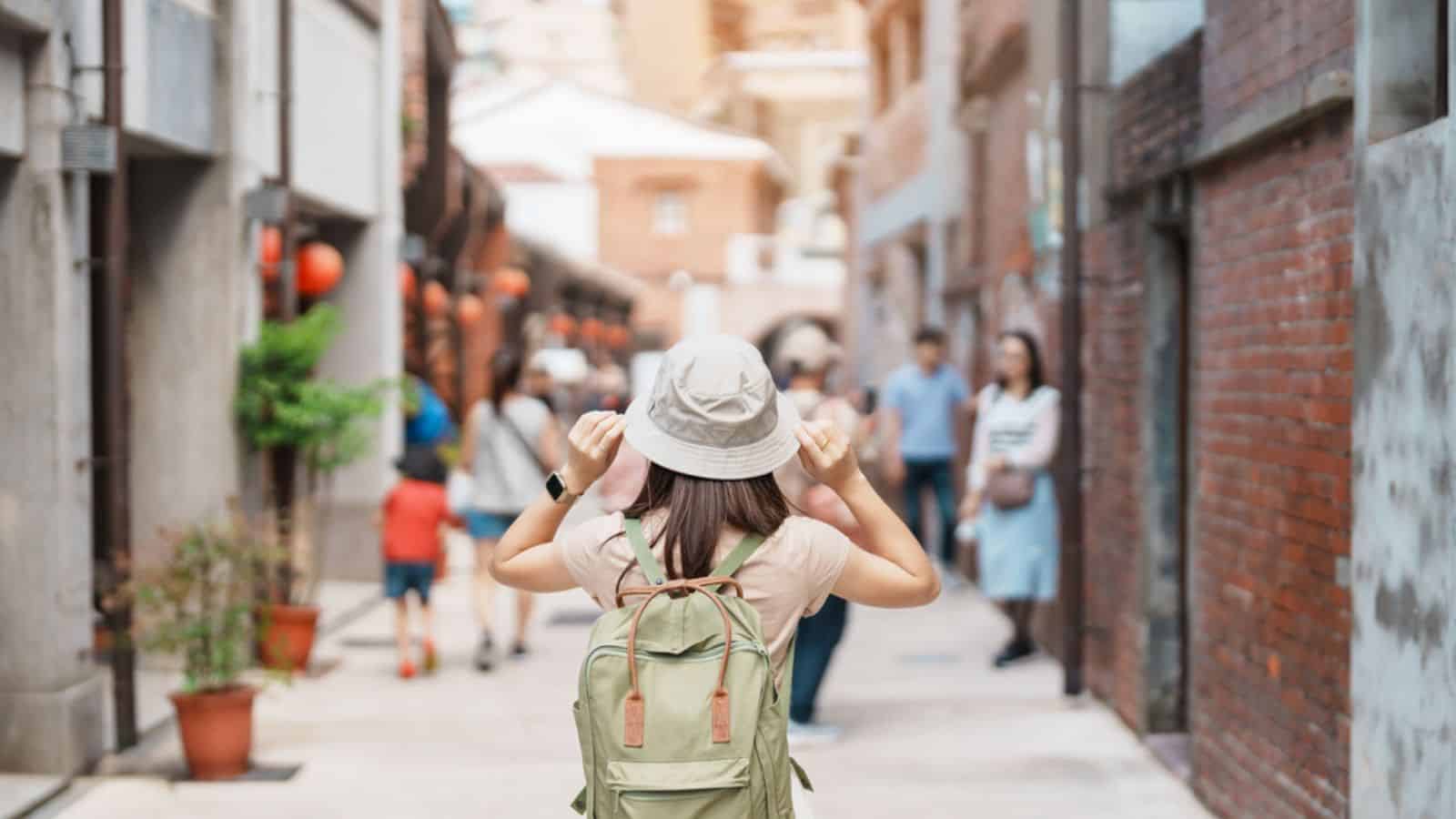 Woman traveler visiting in Taiwan, Tourist with backpack and hat