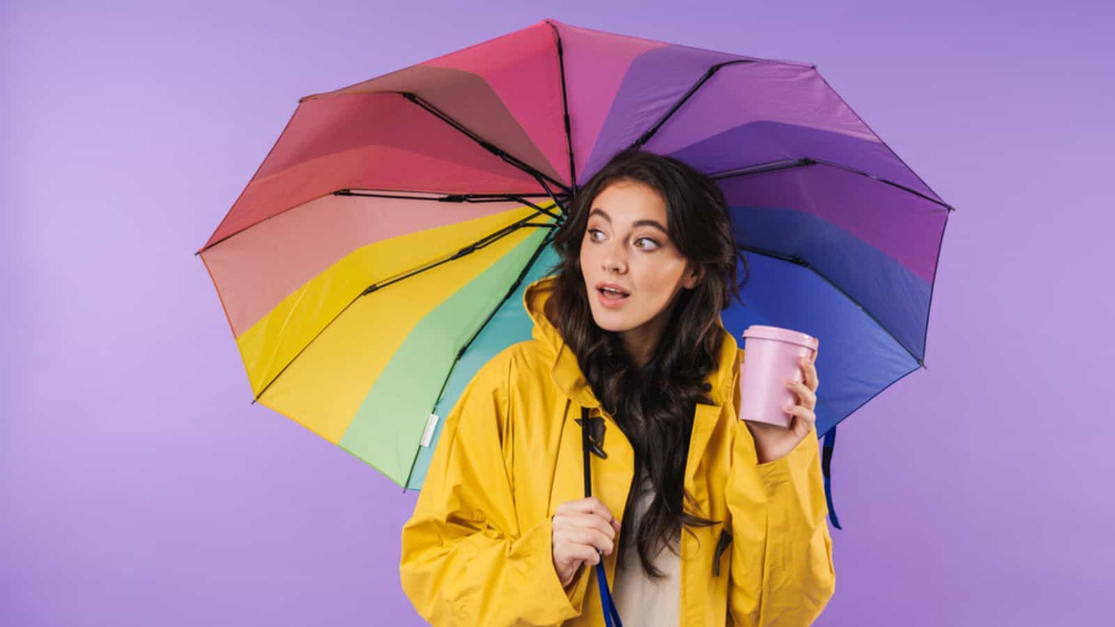 Woman with umbrella and cup