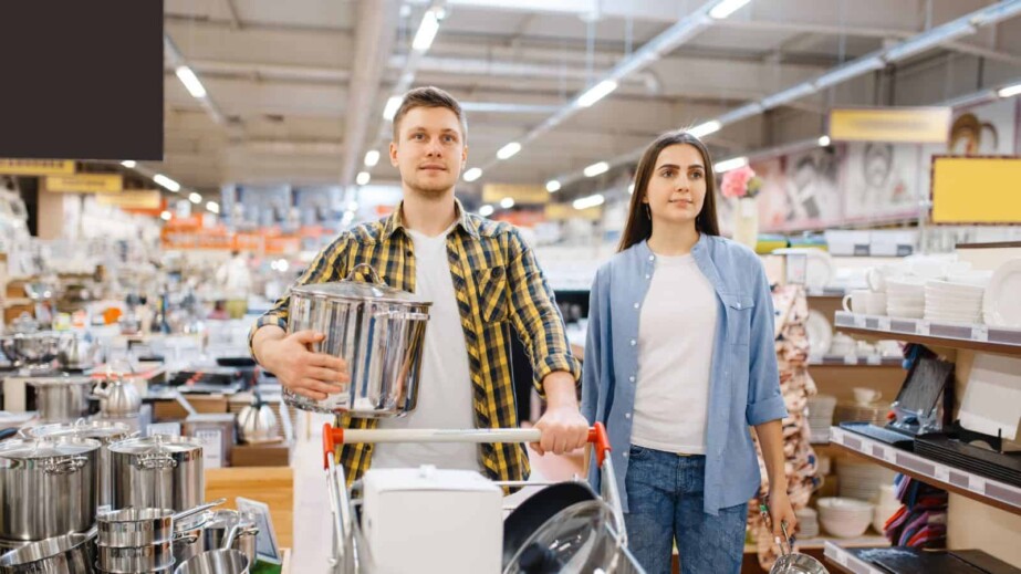 Young Couple with Cart in Houseware Store 